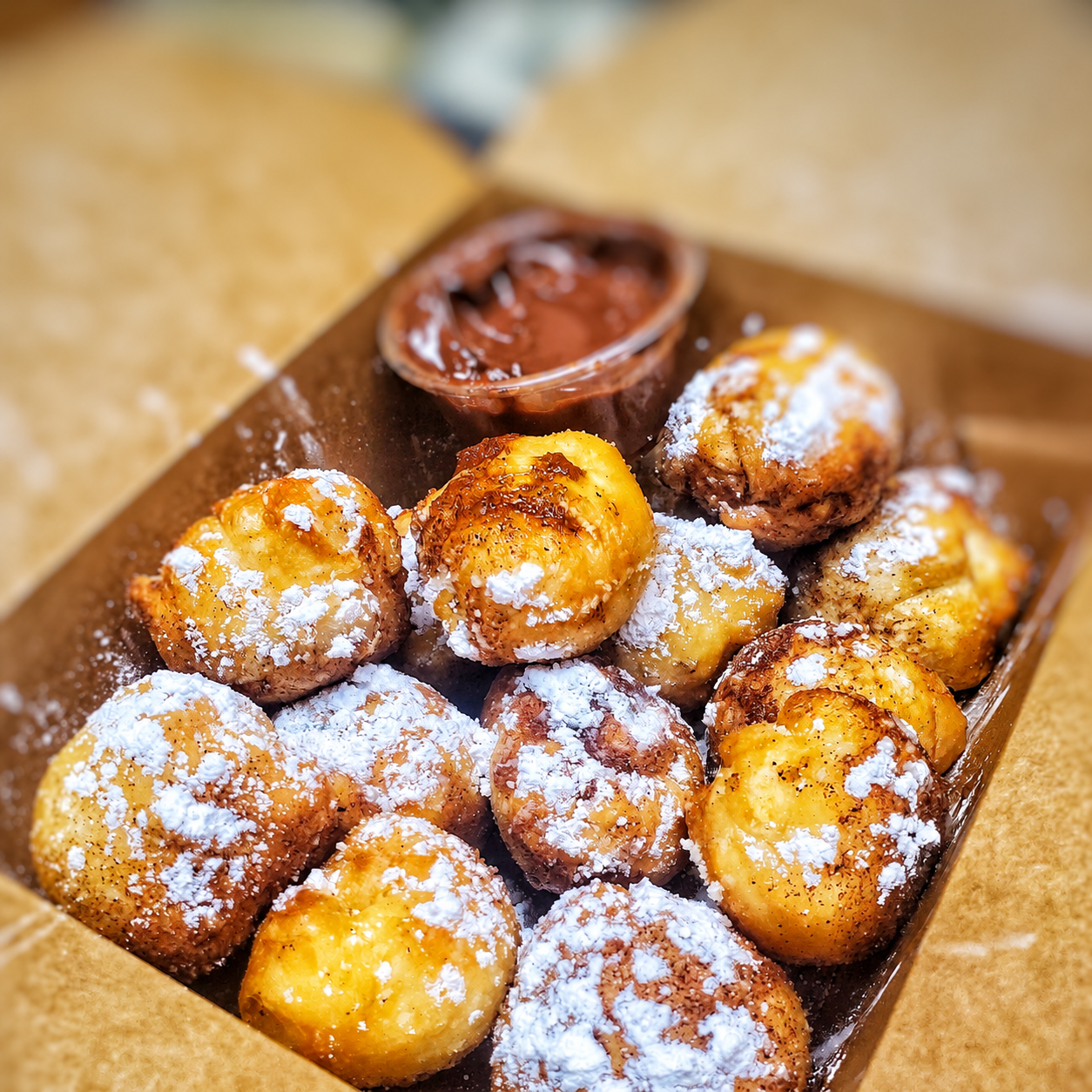 Cinnamon-sugar dough balls with chocolate dipping sauce